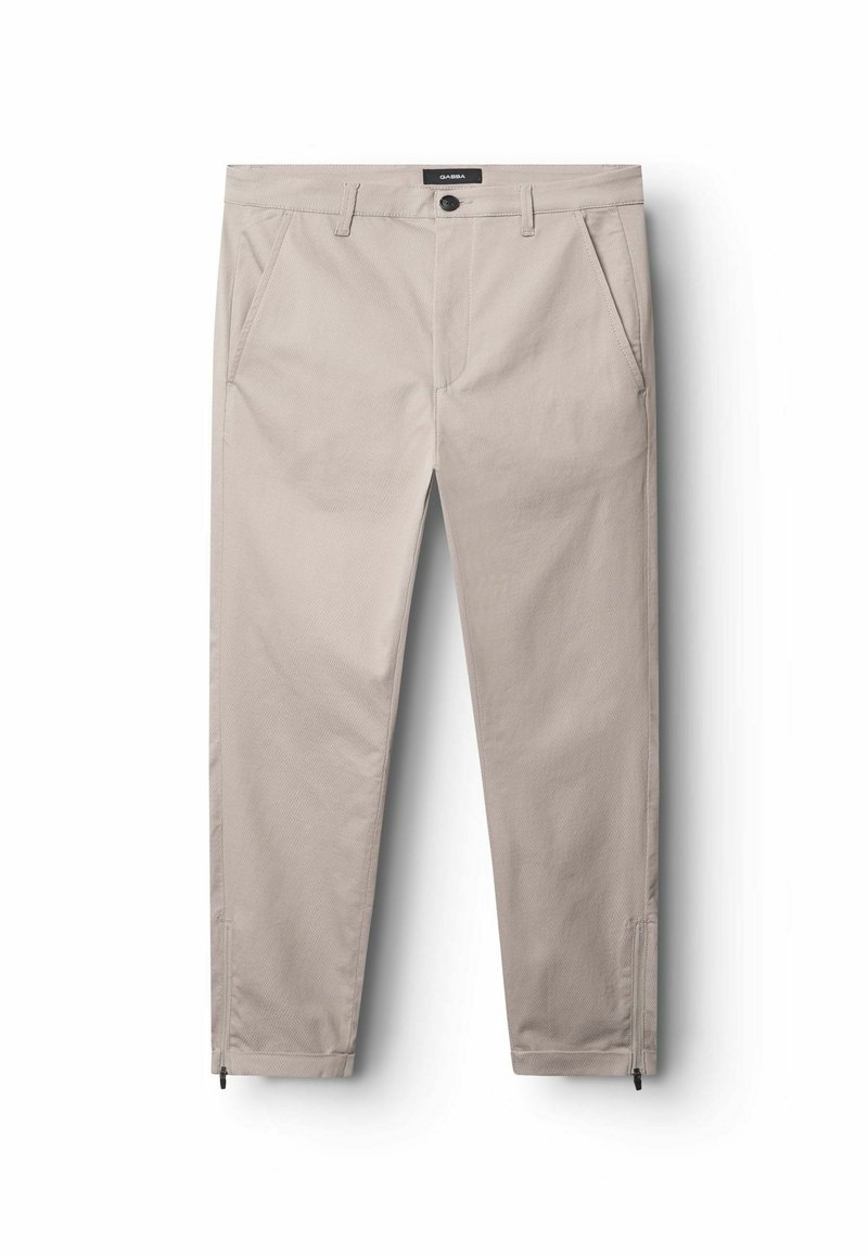 Beige Hosen aus strukturiertem Stoff, mit Taschen vorne, einem Knopfverschluss und Reißverschlussdetails an den Knöcheln.