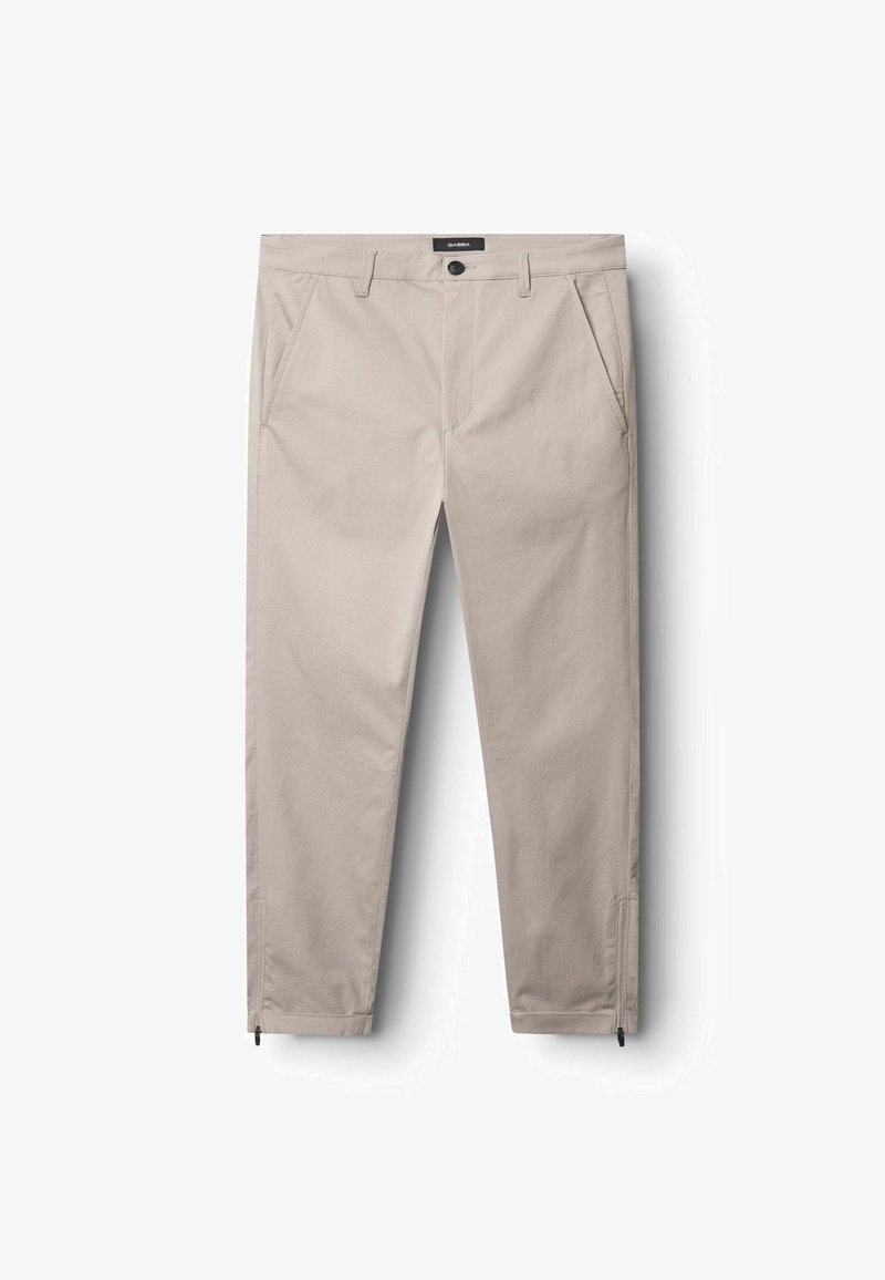 Kreemi värvi püksid, mis on valmistatud tekstureeritud kangast, esipockets, nööbiga sulgemine ja lukud pahkluudel.