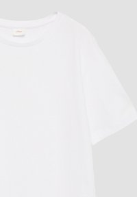 Effen wit katoenen T-shirt met korte mouwen, een ronde halslijn en een klein beige merklabel aan de binnenkant van de kraag.