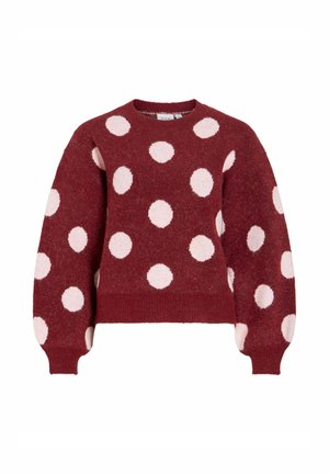 Bordeauxrode trui met grote roze polka dots, ronde hals en lange mouwen. Zachte textuur met geribbelde zoom en manchetten.