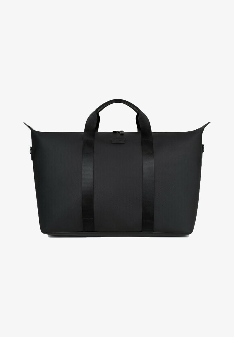 Sac de sport noir avec une finition lisse et mate. Comprend des poignées doubles en haut, une fermeture à glissière et un design minimaliste sans logos visibles.