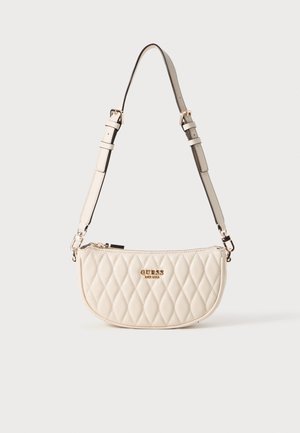 Quilted cream handbag with gold-tone hardware and adjustable strap. Semi-circular shape and zip closure feature the brand logo on the front.