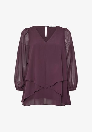 Bluza w kolorze śliwkowym w warstwowym fasonie, z dekoltem w kształcie V, bufiastymi rękawami i wycięciem z tyłu. Wykonana z lekkiego, przezroczystego materiału.