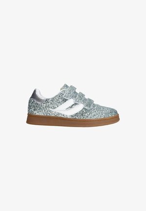 Glittery silver sneaker with three Velcro straps, white accents, and a brown rubber sole. Material has a textured sparkle finish.