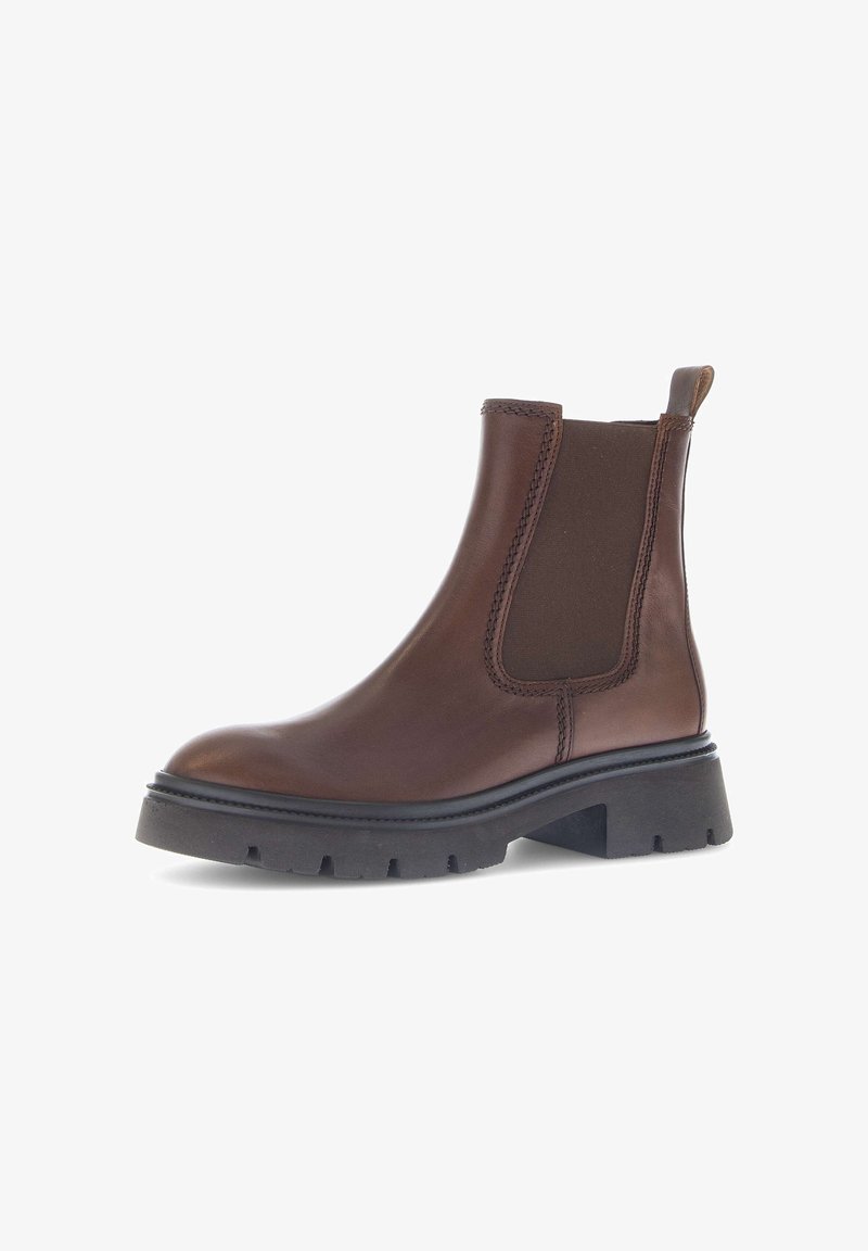 Brown leather Chelsea boot with elastic side panels, round toe, and a chunky black rubber sole featuring deep tread for traction.