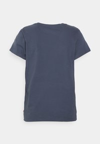 Granatowa bawełniana koszulka z okrągłym dekoltem, krótkimi rękawami i prostym dołem. Posiada gładką tylną część i luźny krój.