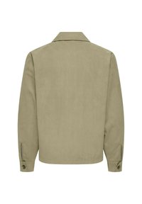 Bézs hosszú ujjú dzseki gallérral, gombos mandzsettákkal és egyenes szegéllyel, fehér háttér előtt hátulról ábrázolva.