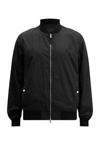 Schwarze Bomberjacke aus leichtem Stoff, mit Reißverschluss, Rundhalsausschnitt sowie elastischen Bündchen und Saum. Mit Seitentaschen.
