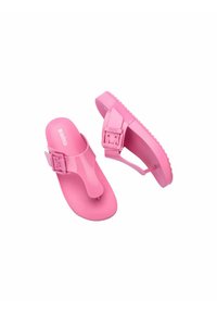 Infradito rosa in plastica liscia, con una fascia a Y e una fibbia regolabile sulla caviglia, dotate di una suola testurizzata per una migliore aderenza.