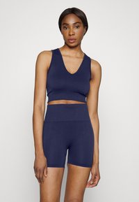 Björn Borg SEAMLESS LIGHT CROP - Top - washed out blue