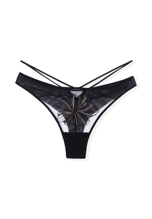 Un string noir en dentelle et tissu opaque, présentant un motif floral en accents noirs et dorés sur le devant.