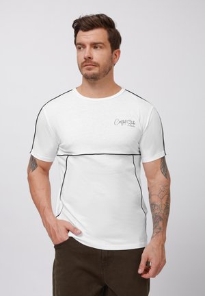 White short-sleeve t-shirt with black accents and stitching. Features a round neckline and a subtle logo on the left chest area.