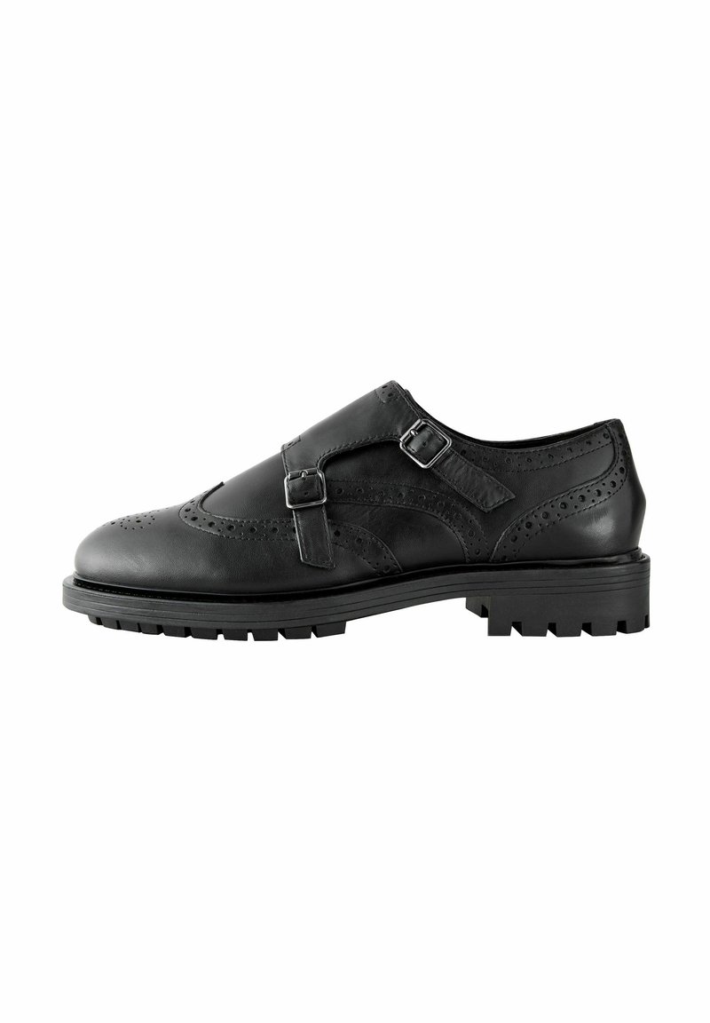 Musta nahkakengät brogue-tyyliin, joissa on kaksinkertaiset soljet, tekstuuriset yksityiskohdat, wingtip-muotoilu ja kestävä pohja.