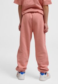 Hummel CLEAN ADJUSTABLE - Trainingsbroek - rose dawn