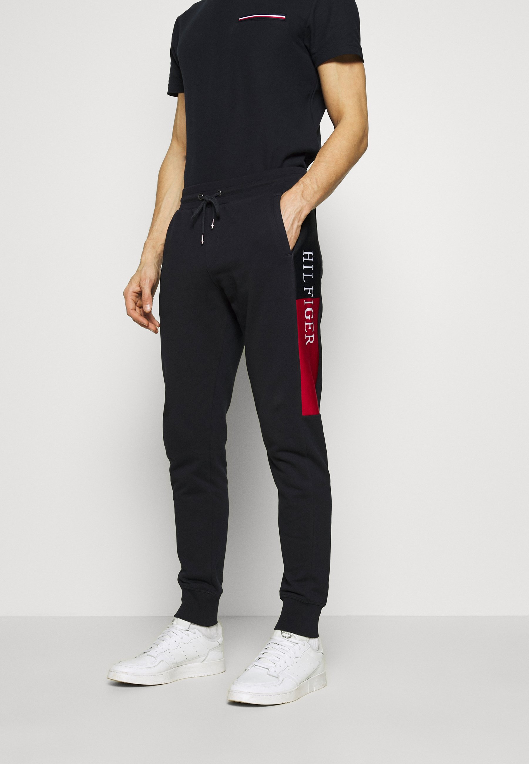 Tommy Hilfiger INTARSIA - Pantaloni sportivi - blue/blu scuro - Zalando.it