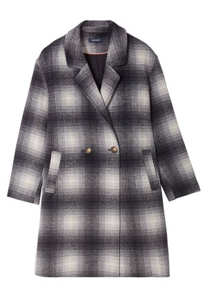 Manteau croisé avec un motif checked noir et blanc. Il possède de grands boutons, deux poches avant et un col cranté. Tissu texturé.