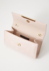 Light pink suede wallet with a gold metal clasp, featuring one main compartment, a card slot, and stitched detailing along the edges.