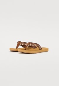 Brown flip-flops with woven textile straps and a solid tan rubber sole. The straps feature a braided design and subtle hardware accents.
