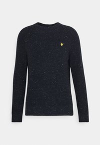 Pull en maille bleu marine avec un design côtelé texturé, manches longues et un petit logo jaune sur la poitrine.