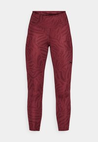 Maroon leggings with an abstract zebra pattern. High-waisted design, stretchy material, and a small black logo on the left side.