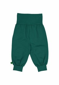 Zelené bavlněné balónové kalhoty s širokým elastickým pasem, nařasenými manžetami a malou dekorativní zelenou visačkou na straně.