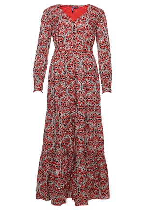 Langes rotes Kleid mit langen Ärmeln, das ein schwarz-weißes abstraktes Blumen- und Wellenmuster sowie einen gestuften Rock aufweist.