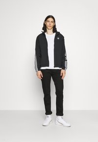 adidas Originals LOCK UPTT - Treniņjaka - black