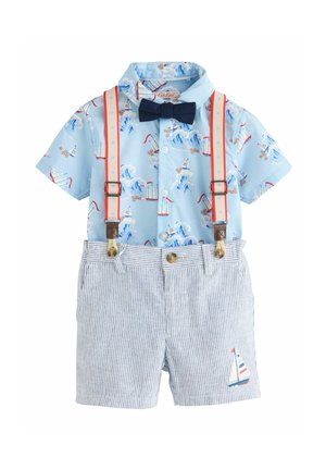 Light blue short-sleeve shirt with boat print and navy bow tie, paired with striped shorts featuring a sailboat embroidery and adjustable suspenders.