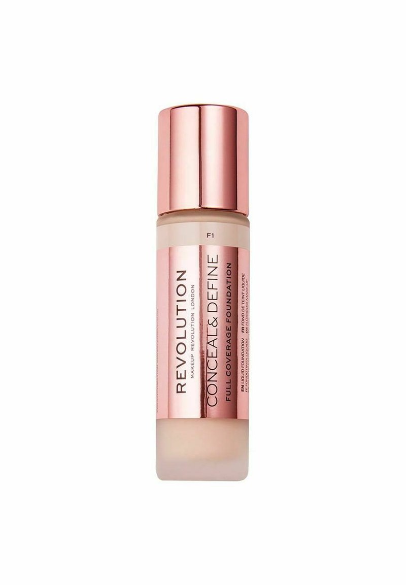 Flydende foundation i en frostet glasflaske med en rosaguld hætte. Har et pink label med teksten "Revolution Conceal & Define F1."