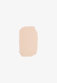 Échantillon de fond de teint crème beige clair avec une texture lisse et mat et une finition légèrement brillante. Le bord est irrégulier en raison de l'application.