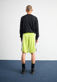 adidas Originals MEGABREAK - Treniņtērpa apakšdaļas - bahia glow