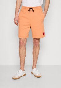 HUGO Treniņtērpa apakšdaļas - medium orange