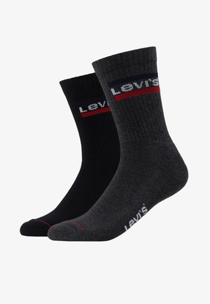 Bomullsmix strumpor i svart och mörkgrå, ribbad design med kontrasterande ränder, med Levi's logotyp i röd och vit på mudden.