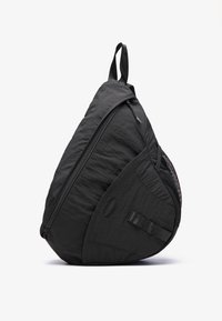 Black backpack with a teardrop shape, made from lightweight fabric, featuring a zip closure, mesh pocket, and adjustable strap.