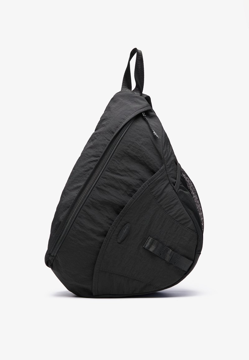 Black backpack with a teardrop shape, made from lightweight fabric, featuring a zip closure, mesh pocket, and adjustable strap.