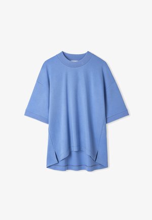 Short-sleeve blue top made of soft fabric, featuring a ribbed neckline, side slits, and a slightly oversized fit. Smooth texture throughout.