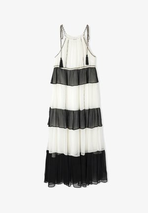 Maxikleid mit schwarz-weißen, schichtweisen Rüschen, das eine durchsichtige Textur, verstellbare Schnüre und Quastenakzente aufweist.