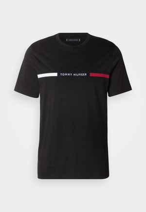 Black cotton t-shirt featuring a crew neck, short sleeves, and a horizontal design with white and red stripes, and “TOMMY HILFIGER” logo.