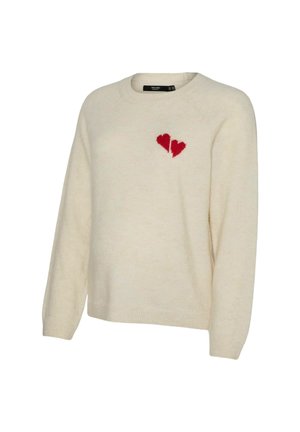 Jersey de punto color crema con mangas largas y un diseño de corazón roto rojo en el lado izquierdo del pecho.
