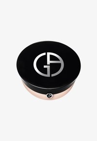 Contenitore cosmetico rotondo nero con logo e rifiniture argento, caratterizzato da un esterno liscio e una base traslucida di colore chiaro.