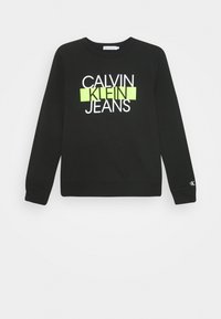 Schwarzer Sweatshirt aus Baumwollmischgewebe mit einem auffälligen Grafikdruck von "CALVIN KLEIN JEANS" in Weiß und Neongrün.