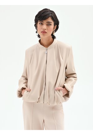 IN CON MANICHE A PALLONCINO - Veste en similicuir - beige turtle