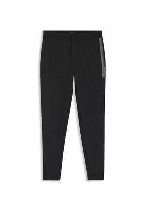 Black tapered jogger pants with elastic waistband, drawstring, side stripe, and cuffed ankles.