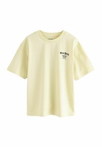 Gul bomulls T-shirt med korta ärmar, rund halsringning och en tryckt "New York"-logotyp i svart på vänster framsida.