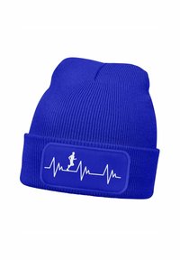 Blue knitted beanie with a folded cuff, featuring a white heartbeat line graphic and a running figure on a rectangular patch.
