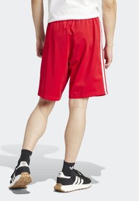 adidas Originals Teplákové kalhoty - red