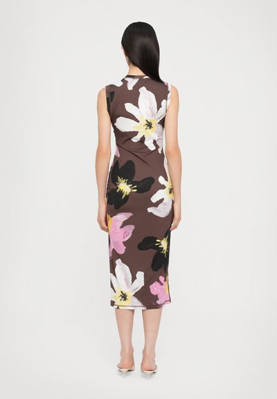 Sleeveless brown dress featuring large, colorful floral patterns in pink, white, and black, with a fitted silhouette that falls mid-calf.