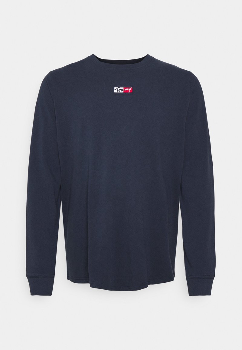 Marineblå langærmet T-shirt lavet af bomuld, med rund halsudskæring og et lille broderet logo på brystet. Glat tekstur, afslappet pasform.