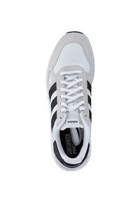 Sneaker in grey, white, and black. Features mesh and suede materials, classic three-stripe design, and cushioned insole for comfort.