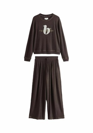 Dark brown waffle-knit long-sleeve top with "Ted Baker" logo and matching wide-leg drawstring pants.